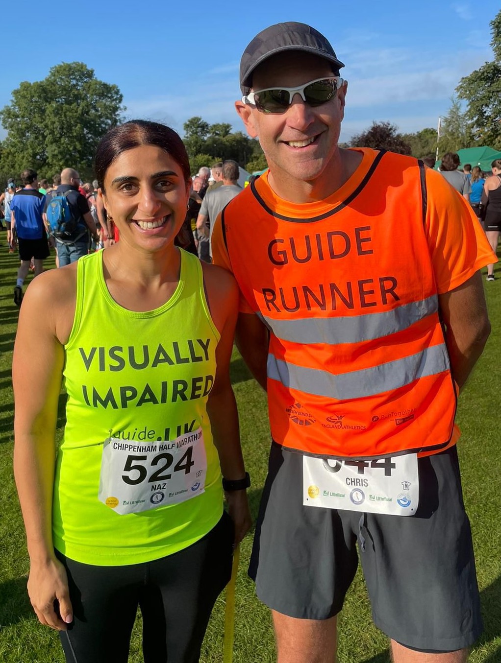 Rehnaz smiling to camera with her Guider Runner, Chris