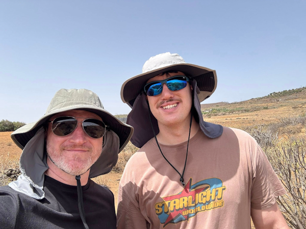 Picture of Andrew and Bailey Walsh wearing hiking hats with neck protection in Gran Canaria countryside.